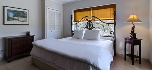 bedroom with a queen bed at Hut Pointe Inn